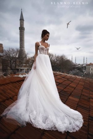 Bride wears A-line wedding dress Dastin by Blammo-Biamo with lace leaves straps, sweetheart bodice, and tulle skirt, image 1