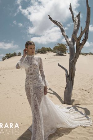 Bride wearing high neck and long sleeve wedding dress Andi by rara avis with a back statement cut, image 4