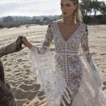 A-line boho style wedding gown Kortal by Rara Avis with split skirt, lace sleeves decorated with colourful embroideries, image 5