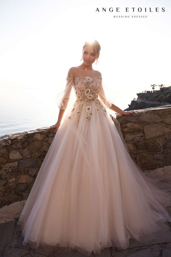 Popular princess wedding gown Lola by ange Etoiles with illusion neckline, off-shoulder long sleeves and decorated with big beaded flowers on the bodice and upper skirt, image 1