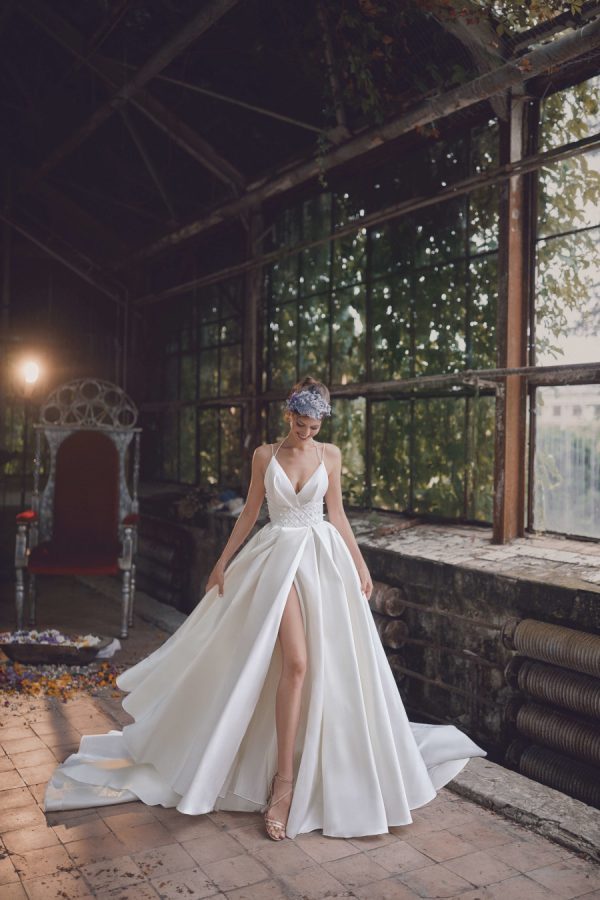 Simple wedding gown with a split on the skirt