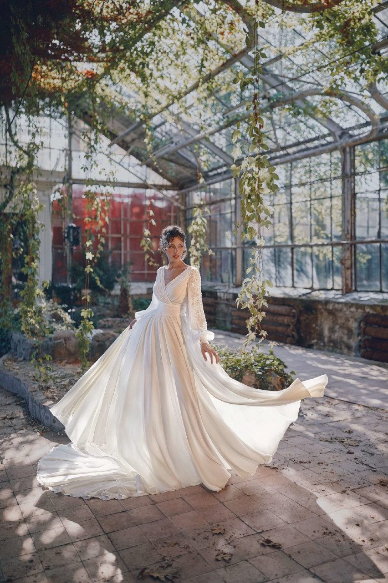 chiffon a-line wedding dress Poletta with long beaded sleeves, bow on the waist, low back and two slits on sale by rara avis 1