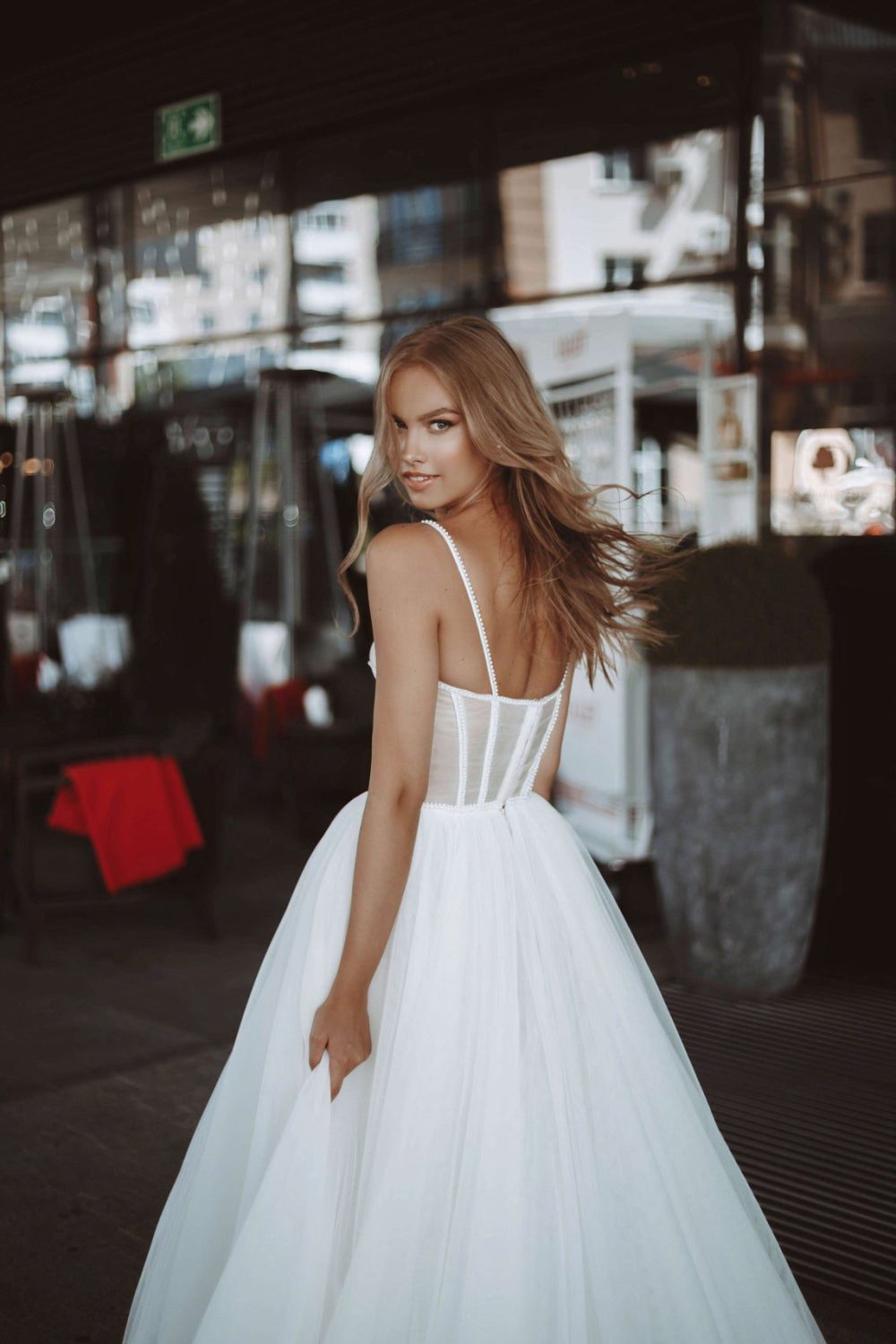 Rara Avis elegant A-line wedding dress Yang with the tulle skirt and fitted bodice with the sweetheart neckline and pearls decorations at Dell"Amore Bridal, NZ.3