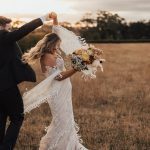 Dell'Amore bride in her bohemian bridal gown Lari by rara avis with long lace sleeves