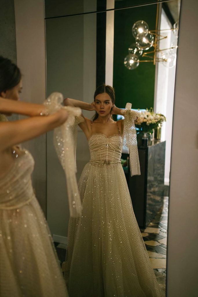 Glamorous wedding dress Avis by rara avis with sparkles on a-line skirt, belt and thin straps. 