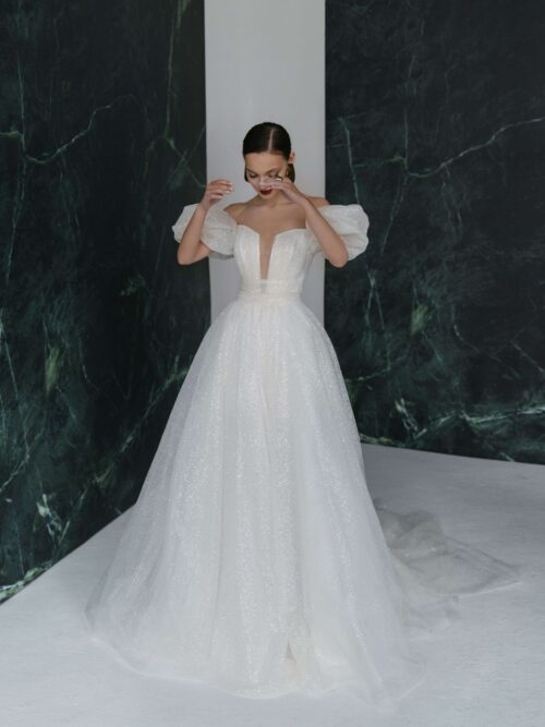 A-silhouette wedding dress with glitter, sleeves and a bow by rara avis. 5