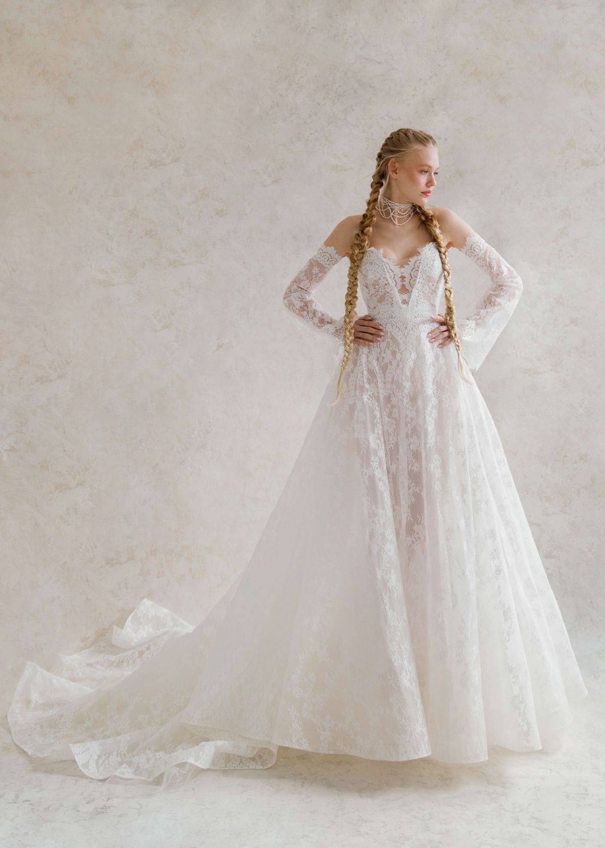 A-silhouette couture lace wedding dress with removable long sleeves at Dell'Amore , Auckland, NZ. 12