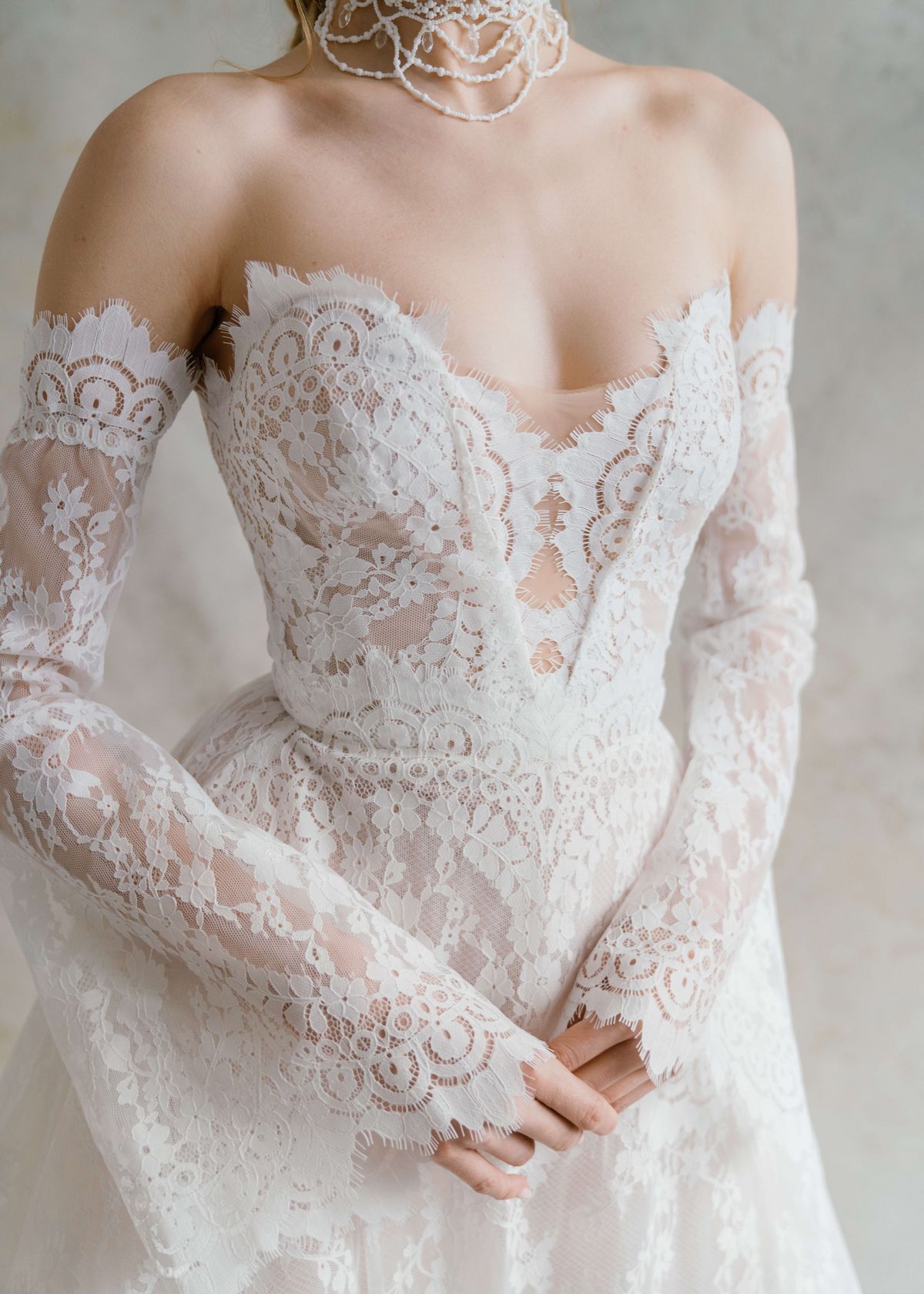 A-silhouette couture lace wedding dress with removable long sleeves at Dell'Amore , Auckland, NZ. 11
