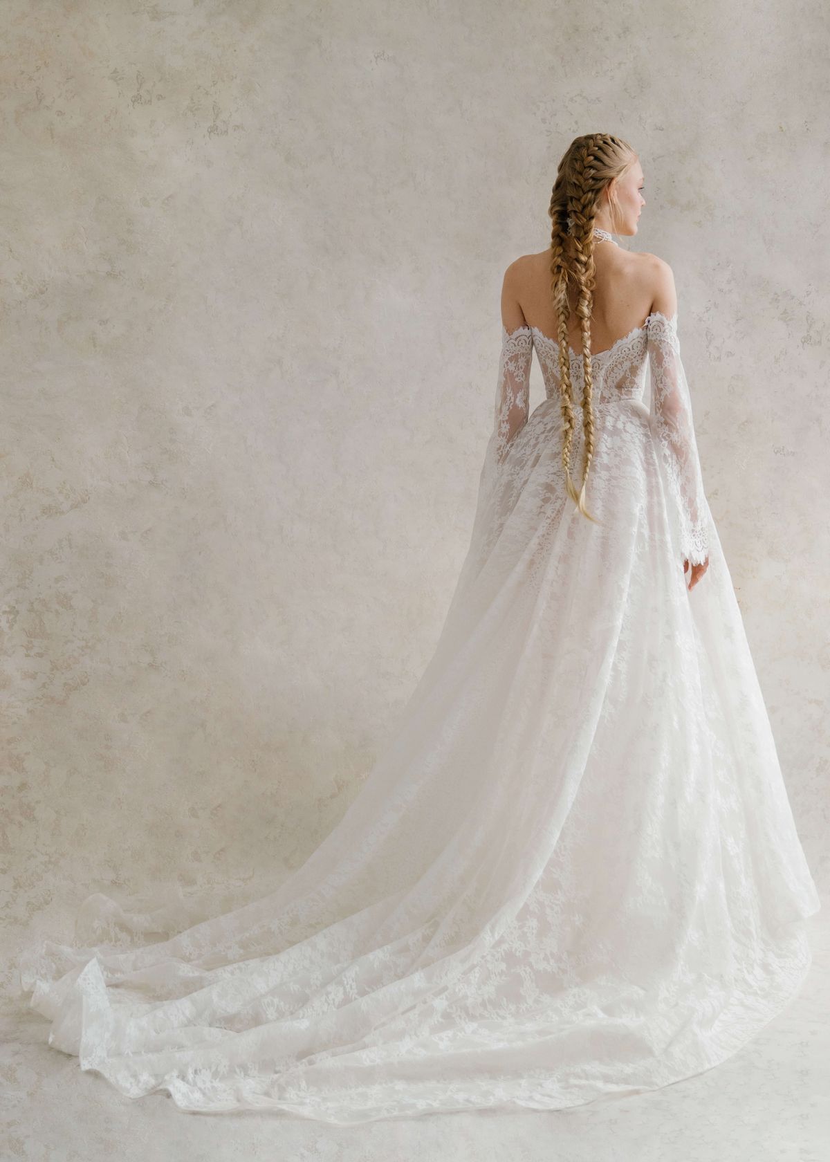 A-silhouette couture lace wedding dress with removable long sleeves at Dell'Amore , Auckland, NZ. 9