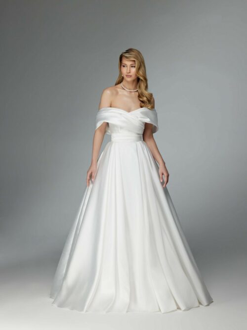 Simple elegant wedding dress with a long train and removable sleeves by ange etoiles. 2