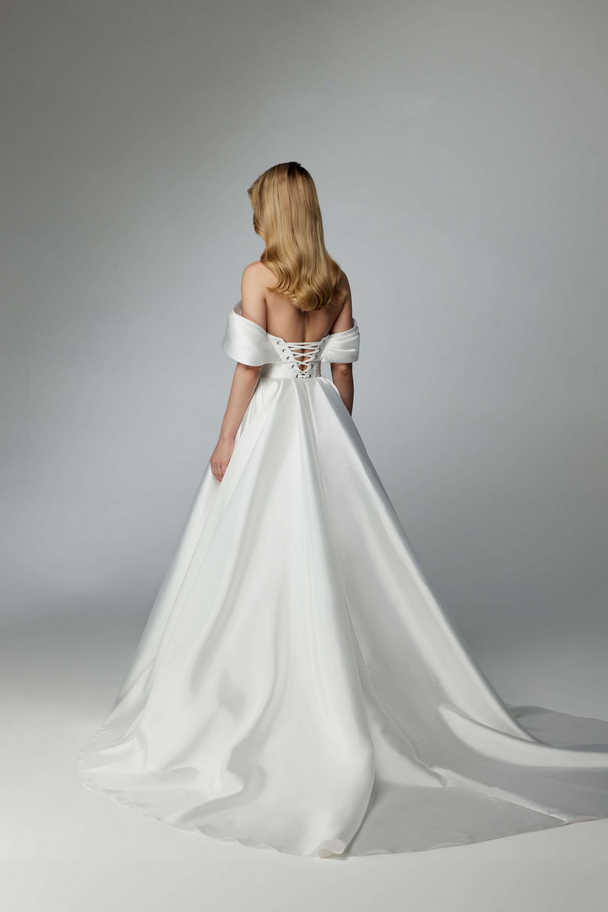 Simple elegant wedding dress with a long train and removable sleeves by ange etoiles. 1