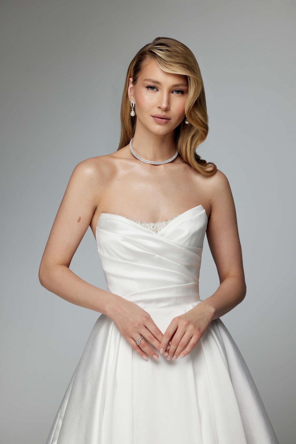 Simple elegant wedding dress with a long train and removable sleeves by ang etoiles. 1
